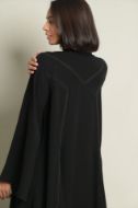 صورة Plain abaya with inserted lines.